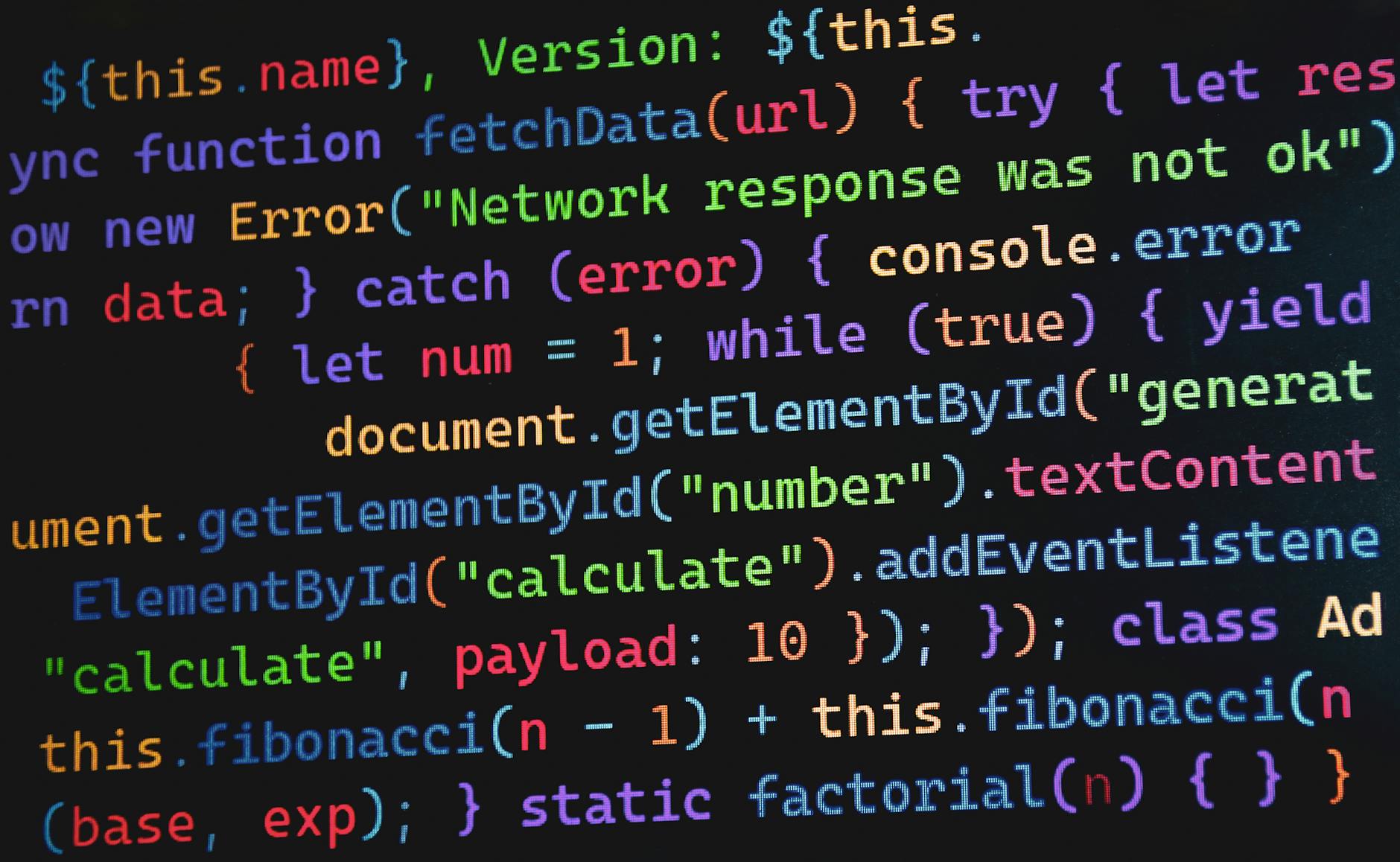 Kolorowy kod JavaScript na monitorze ilustrujący programowanie