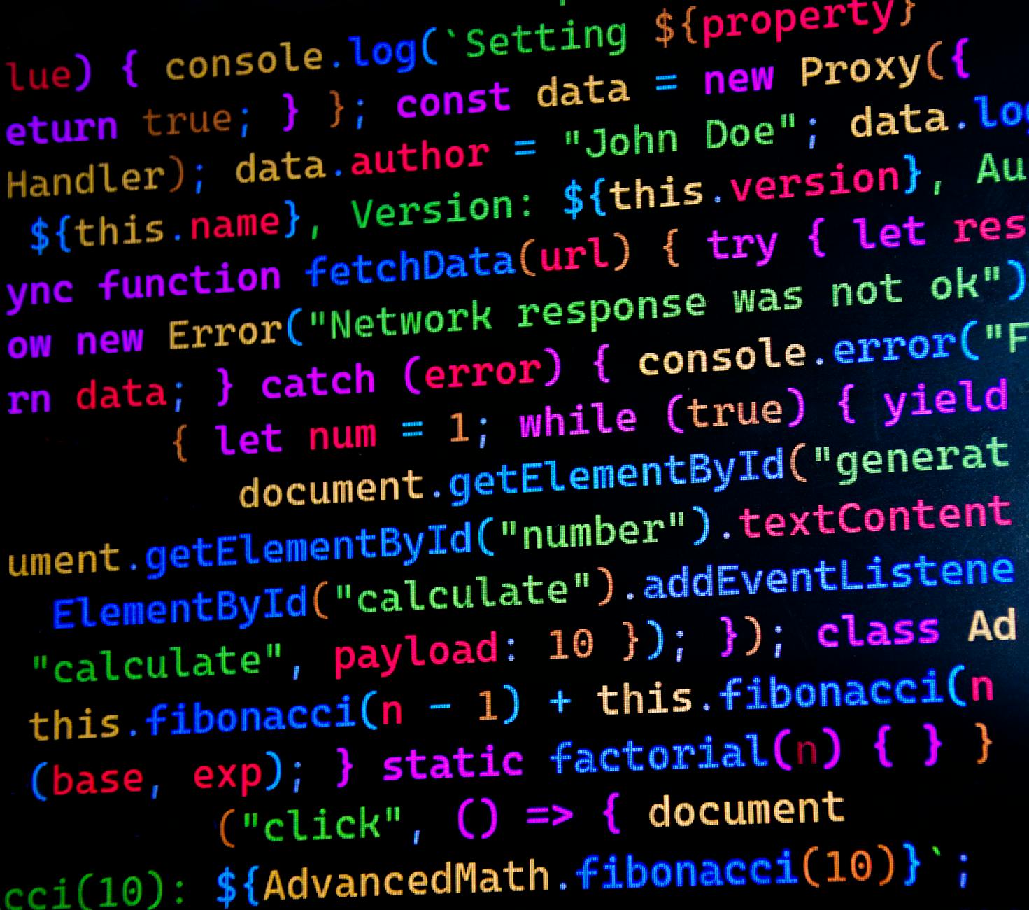 Zbliżenie kolorowego kodu JavaScript na monitorze komputerowym